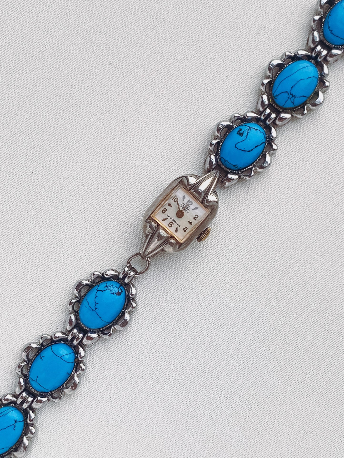 Turquoise Watch with a Square Dial